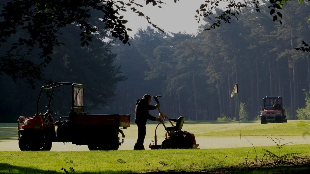 Image of greenkeepers on green